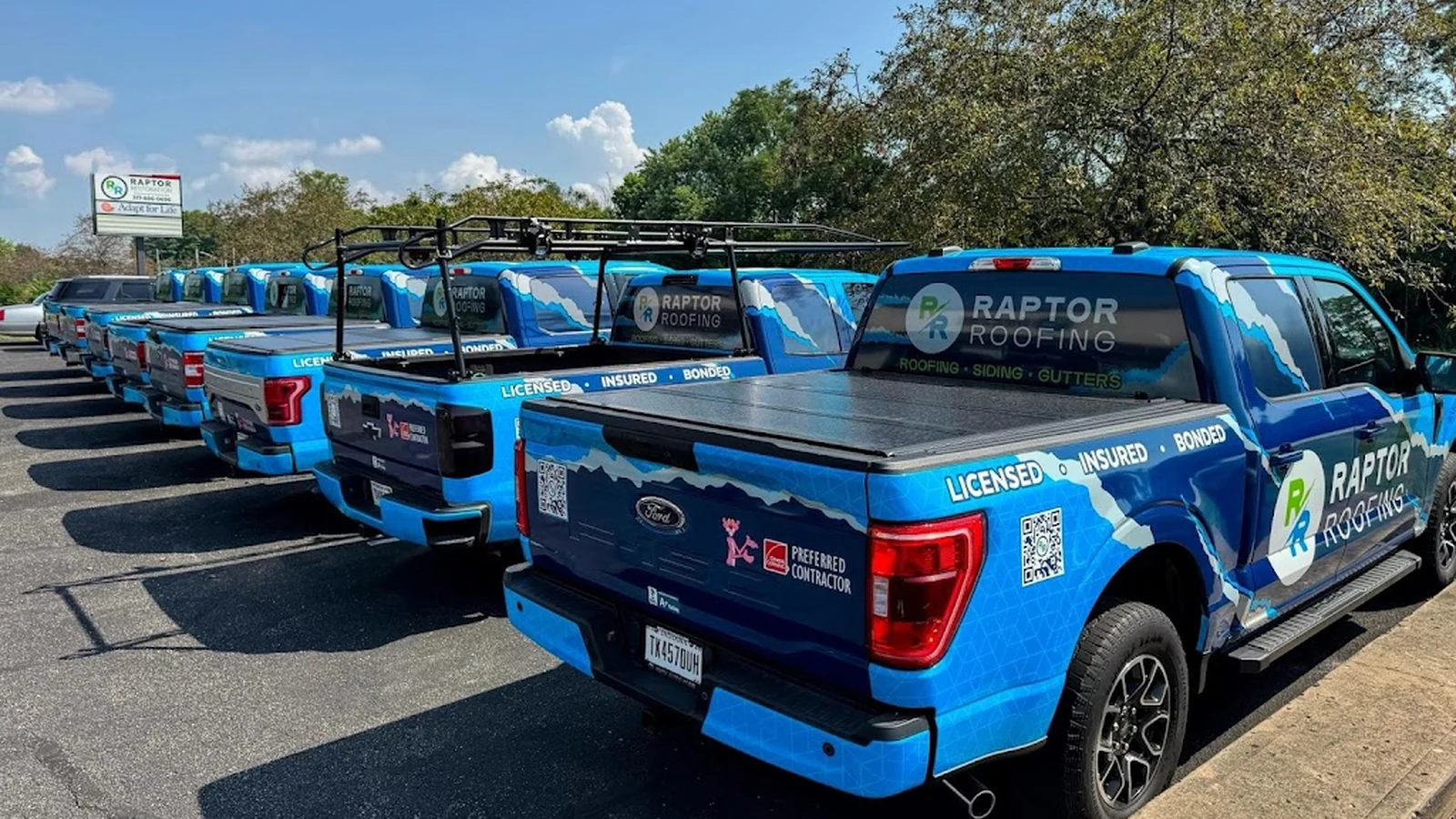Raptor Roofing trucks lined up outside the Indianapolis office